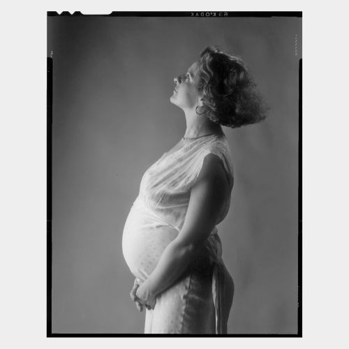 Portrait of very pregnant woman body taken from the side