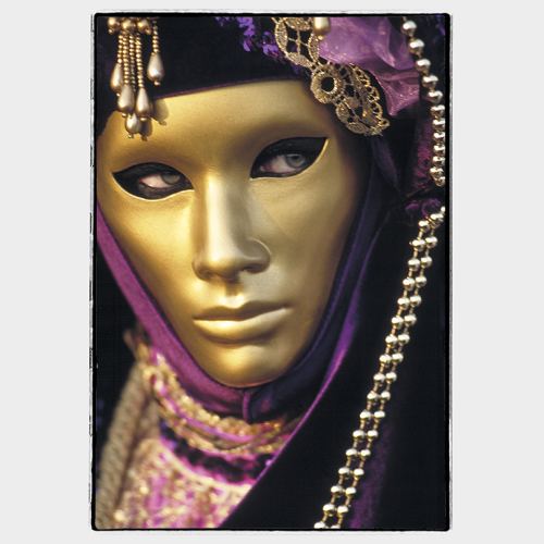 Venice: rich golden mask with black cape