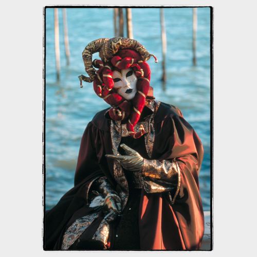 Venice: masked woman in front of the lagoon