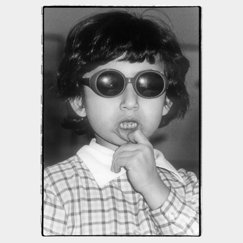 Small girl with big dark sunglasses